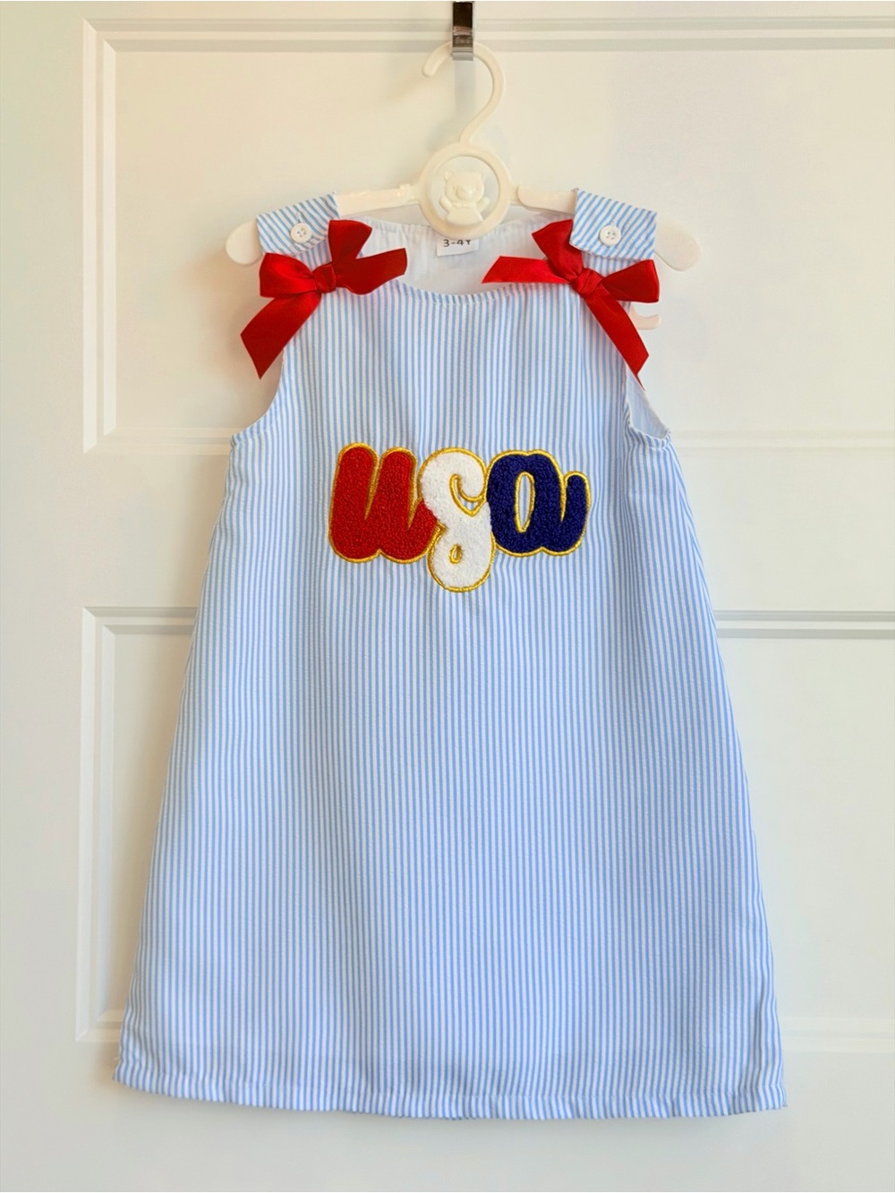 Girls' Light Blue Seersucker Dress with Red Bows and USA Appliqué